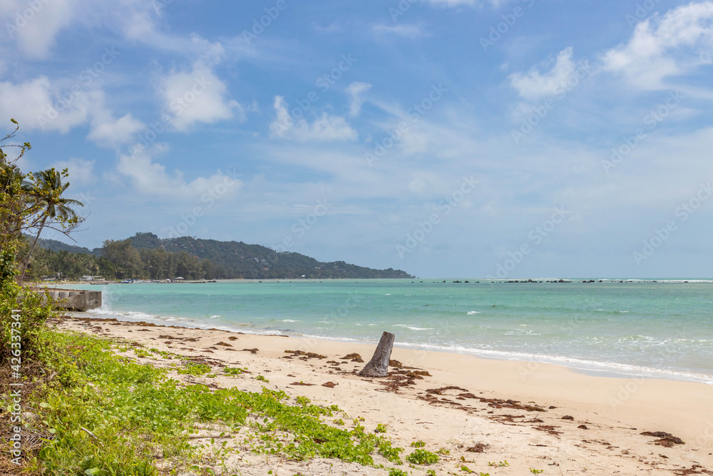 Sea view from tropical beach with sunny sky. Summer paradise beach of Koh Samui island. Tropical shore. Tropical sea in Thailand.