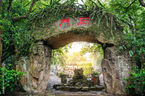 Fototapeta Naklejka Na Ścianę i Meble -  Ancient volcanic village entrance gate made of volcanic rock at Huoshankou volcanic cluster national park in Haikou Hainan China