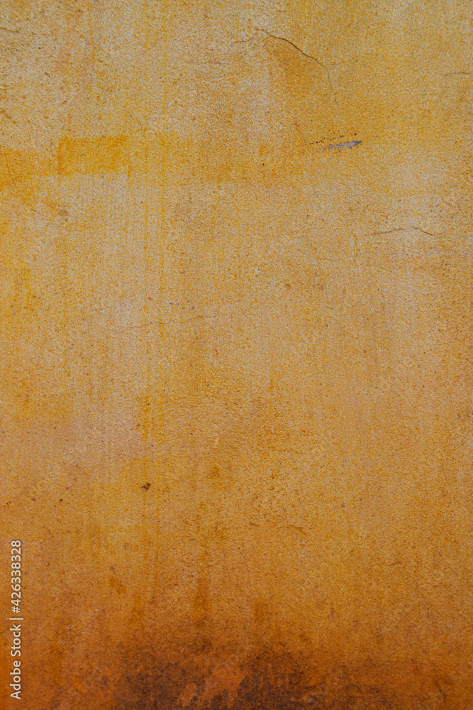 Fototapeta premium Rough yellow concrete wall background, dirty yellow background