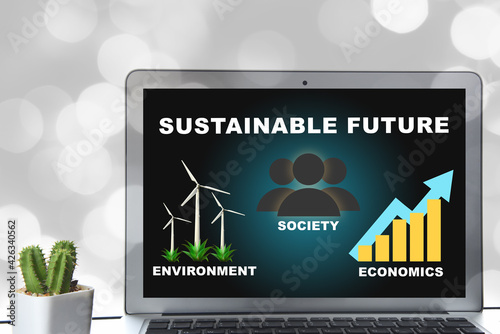 Sustainable future environment protection society and economics on computer laptop screen on bokeh background. Sustainability development concept and smart technology idea