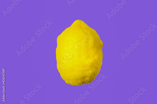 Fotografi Lemon isolated without shadow on a violet background