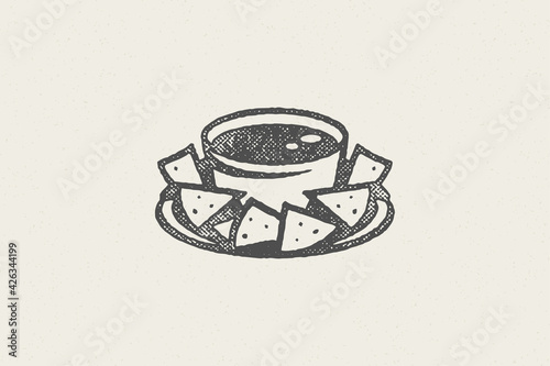 Mexican nachos silhouette into bowl with sauce for fast food hand drawn stamp effect vector illustration photo