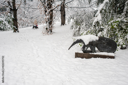 Anteater statue covered with snow in a park in Geneve, Switzerland
