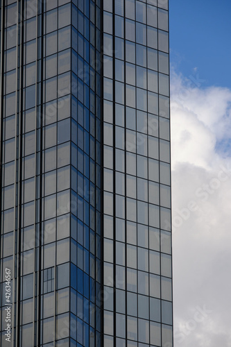 Architecture fragment of a skyscraper on the background of the sky. Business background