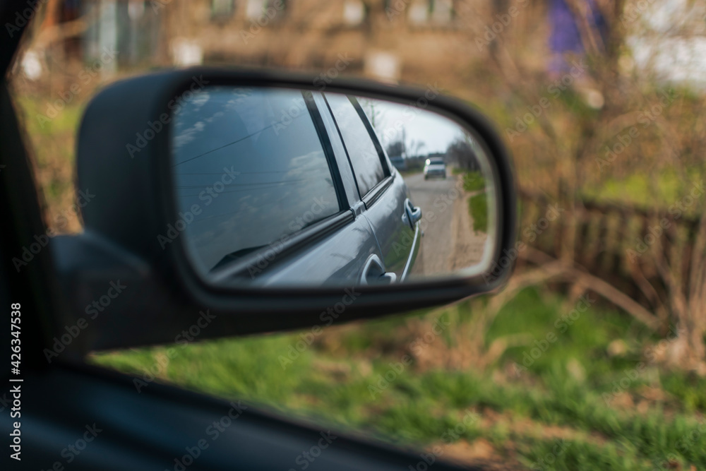 reflection in the side mirror of the car reflection in the side mirror of the car