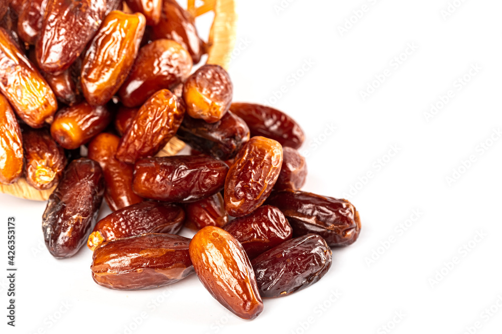 Dates fruit on white background, close up. Ramadan kareem with dates. Religious Muslim background for the holy month of Ramadan Dates fruit on white background, close up. Ramadan kareem with dates. Religious Muslim background for the holy month of Ramadan