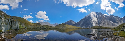 panorama of a mountain lake in the valley of seven lakes near Belukha Altai mountain