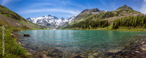 panorama of the lake with emerald water on the background of the mountains