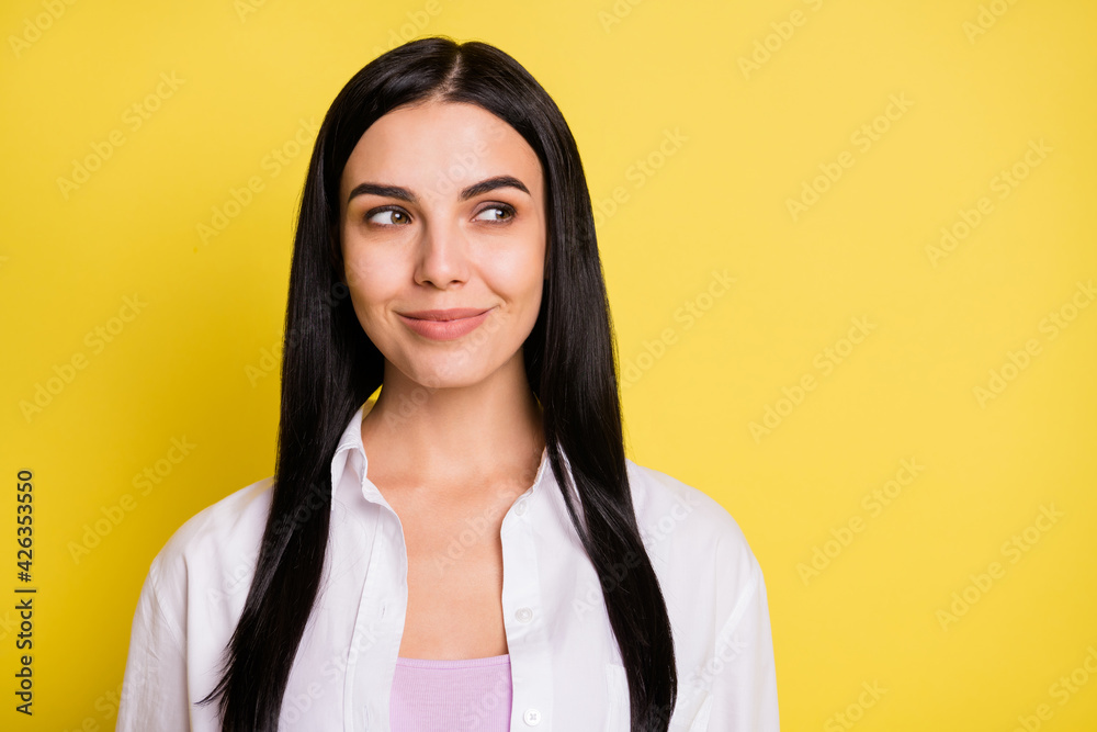 Photo of dreamy charming young woman look empty space imagine idea isolated on yellow color background Photo of dreamy charming young woman look empty space imagine idea isolated on yellow color background