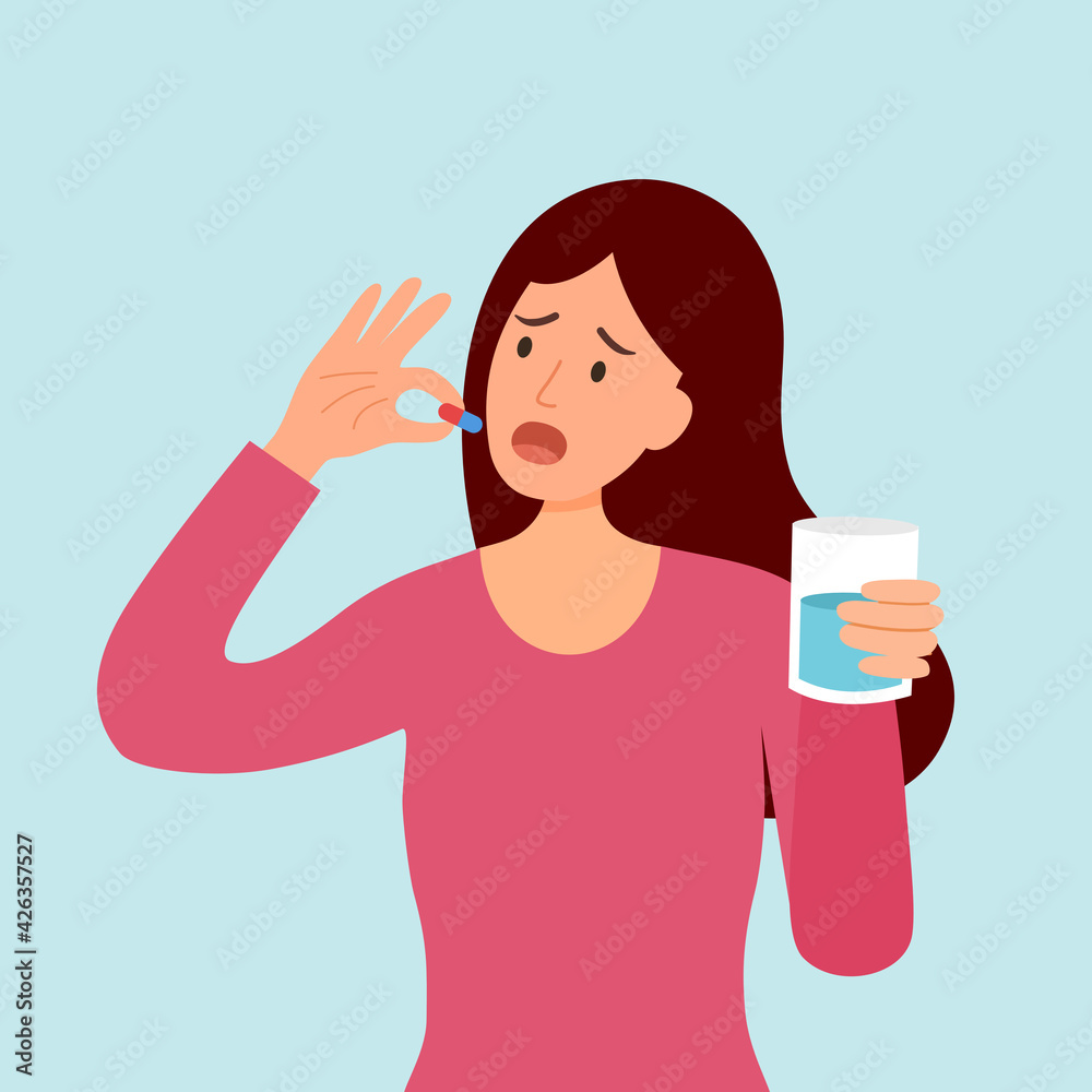 Woman taking medicine for illness treatment. Female take vitamin or supplement capsule pill with water.