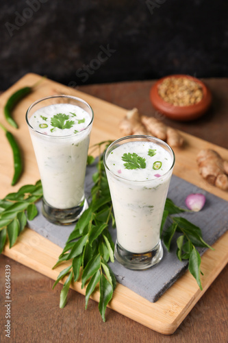 Spiced buttermilk , chaas , chaach , moru , sambharam , curd, lassi , yogurt, cool refreshing drink for hot summer in glass , Kerala, India. Flavored Indian buttermilk.