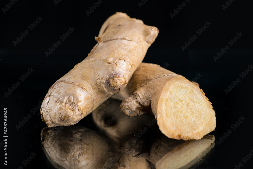 Fototapeta premium ginger from china on a black background