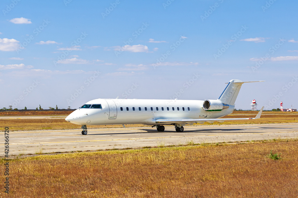 Big passenger airplane drives along the runway in airport Big passenger airplane drives along the runway in airport