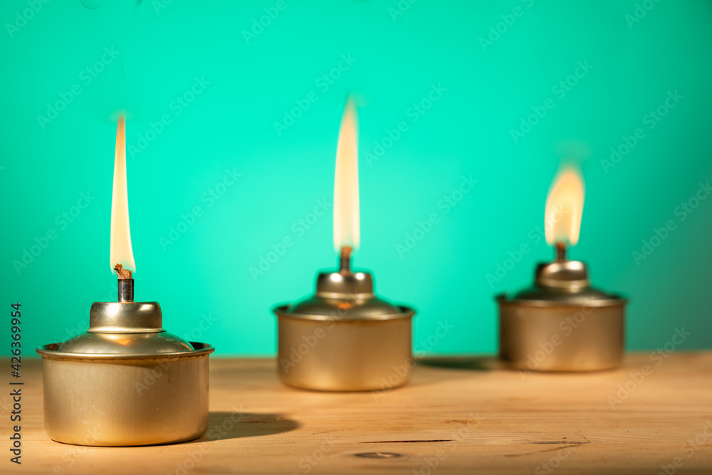 Pelita or oil lamp, traditional Malay oil lamp lit up during Ramadan and Hari Raya Aidilfitri Muslim celebration Pelita or oil lamp, traditional Malay oil lamp lit up during Ramadan and Hari Raya Aidilfitri Muslim celebration