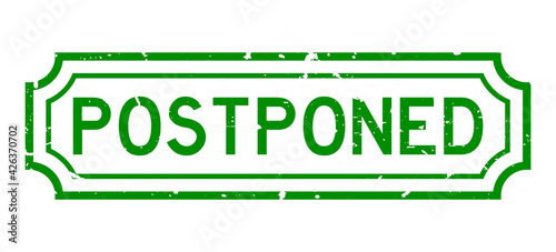 Grunge green postponed word rubber seal stamp on white background