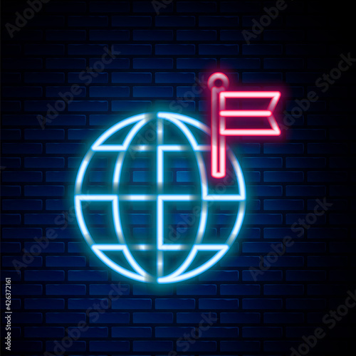 Glowing neon line Planet with flag icon isolated on brick wall background. Victory, winning and conquer adversity concept. Colorful outline concept. Vector