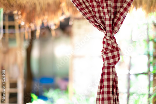 Plaid fabric is tied to decorate in a restaurant, in a very special atmosphere.