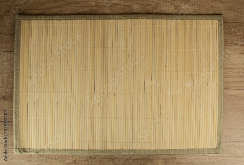 bamboo napkin on a dark wooden table, top view