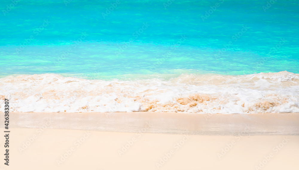 Beautiful Turqouise waves on white sand beach.Tropcal vacation concept.