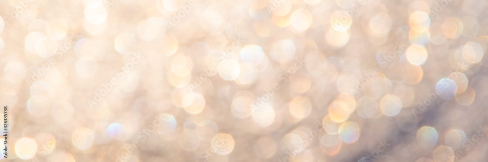 Obraz premium bright glitter background: bokeh effect from many colored lights on frozen glass, toning