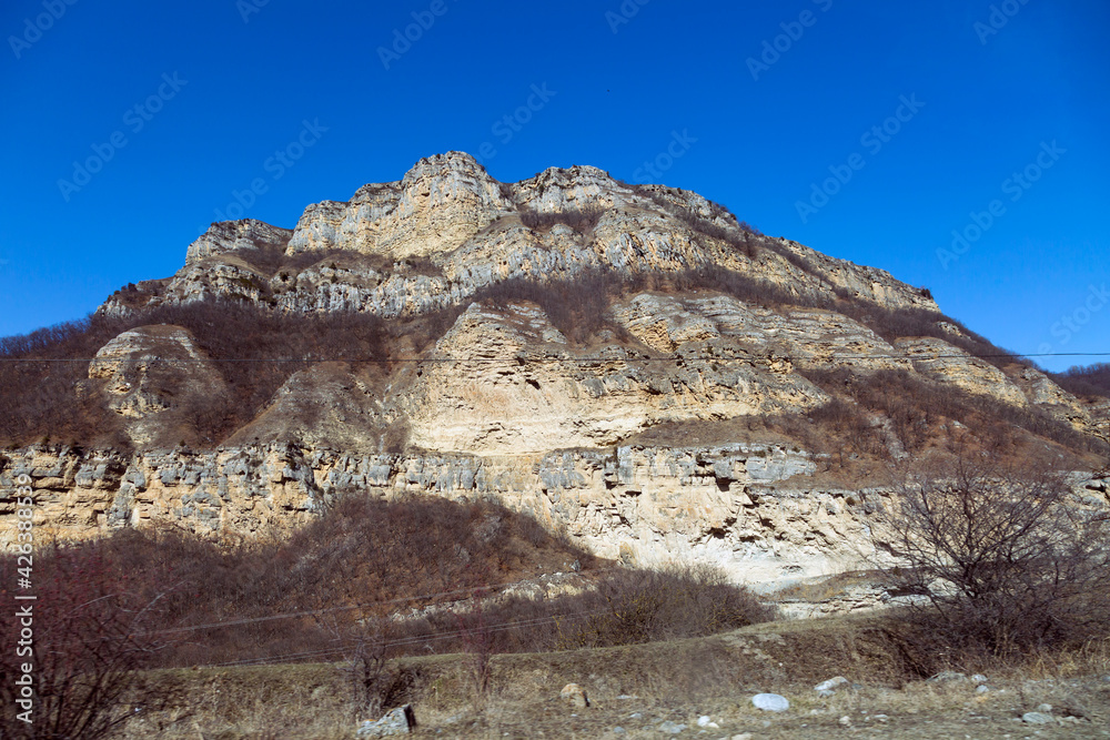 Sheer cliffs in clear weather. North Caucasus, Kabardino-Balkaria, Russia.