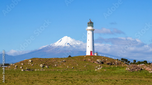 Cape Egmont lighthouse and Mount Taranaki, North Island, New Zealand