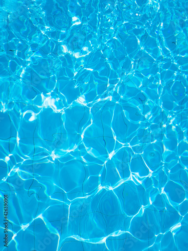 Background of rippled water in swimming pool . Blue ripped water in swimming pool