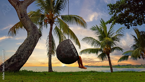 Dreaming in an escape capsule surrounded by tropical palms to find your self 
