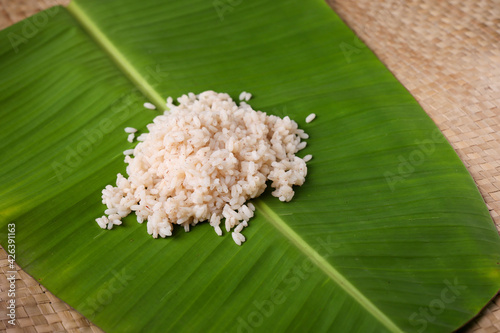 Kerala Matta rice Rosematta rice, Palakkadan Matta rice, Kerala Red rice, parboiled cooked rice served on banana leaf vegetarian meals Onam sadhya brown fiber rich Indian rice, Sri Lanka India  photo