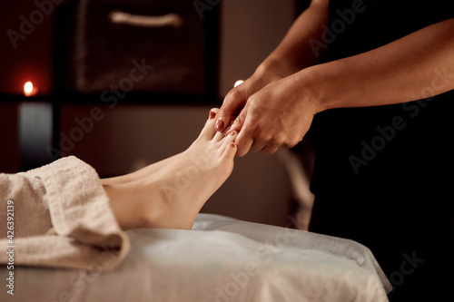 Wallpaper Mural Massage therapist makes hands with oil relaxing foot massage with pedicure. Warm light. Massage parlour. A beauty salon. Spa day. Torontodigital.ca