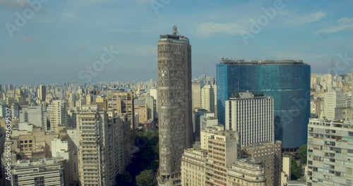 Italy and Copan buildings on sunny day. Aerial approaching shot photo