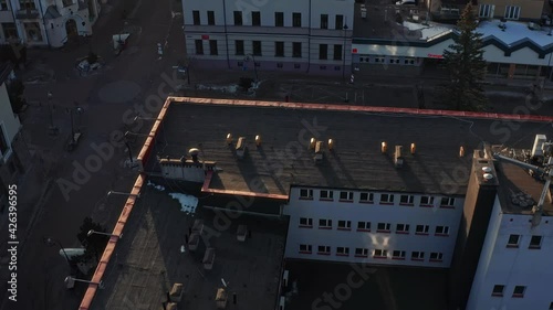 Scenic Aerial View Of Commercial Buildings Along Krupowki Street In Zakopane, Poland On A Sunny Winter Morning. drone tilt-up photo