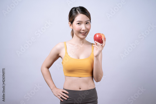 Asian women in yellow sportswear, Isolated on white background, Concept of health care and exercise.