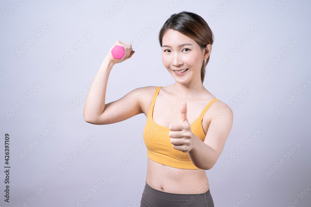 Asian women in yellow sportswear, Isolated on white background, Concept of health care and exercise. Asian women in yellow sportswear, Isolated on white background, Concept of health care and exercise.