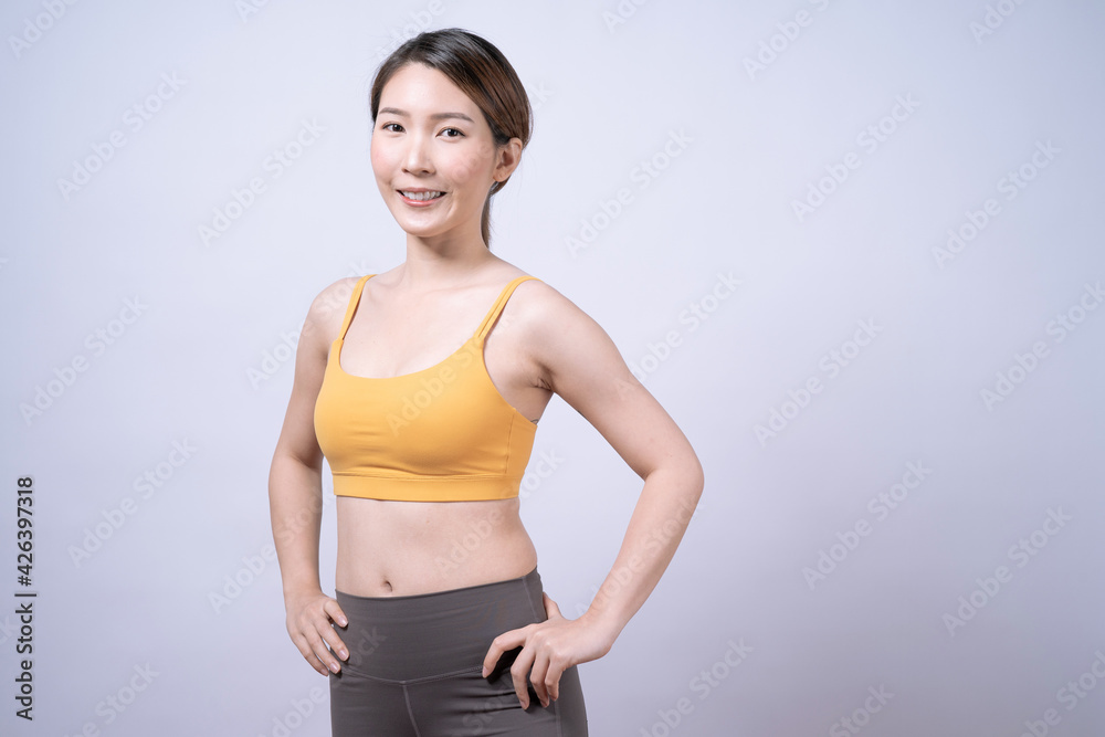Asian women in yellow sportswear, Isolated on white background, Concept of health care and exercise. Asian women in yellow sportswear, Isolated on white background, Concept of health care and exercise.