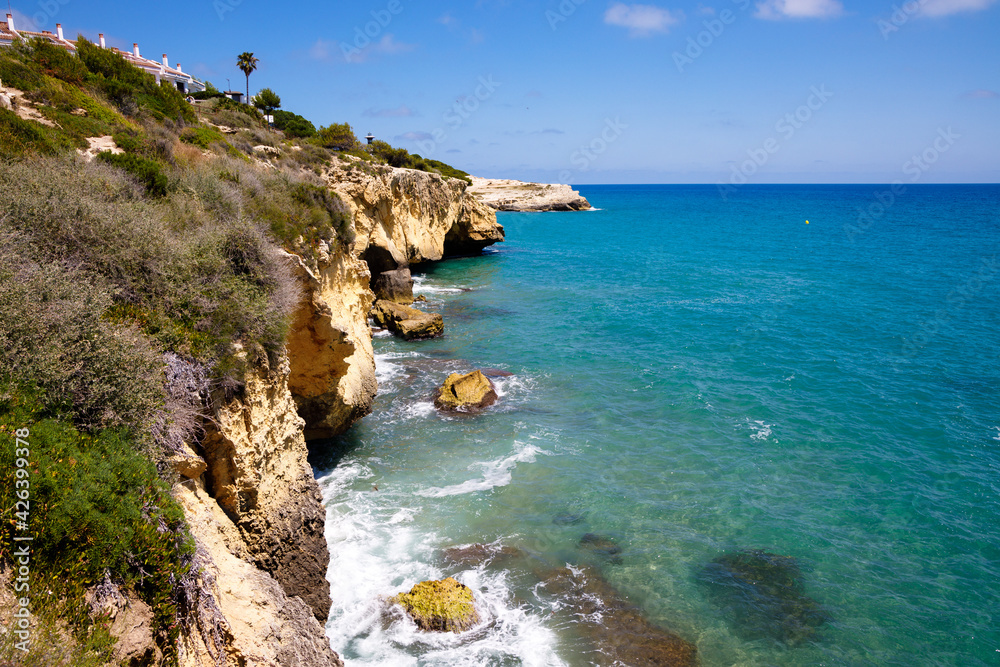 Rocky bluff coastline with turquoise color sea, Tarragona, Spain