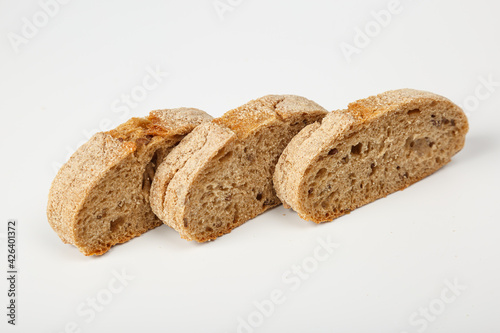 Buckwheat and wheat baguettes on the table. Fresh sliced bread. Bakery product food background. Delicious crispy baguette closeup. Buckwheat bread. Buckwheat baguette on a white background. Buckwheat.