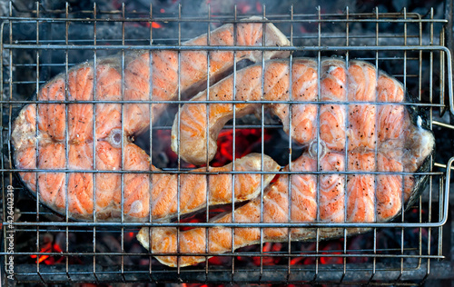 Close up of seafood grilled fish on charcoal barbecue grill