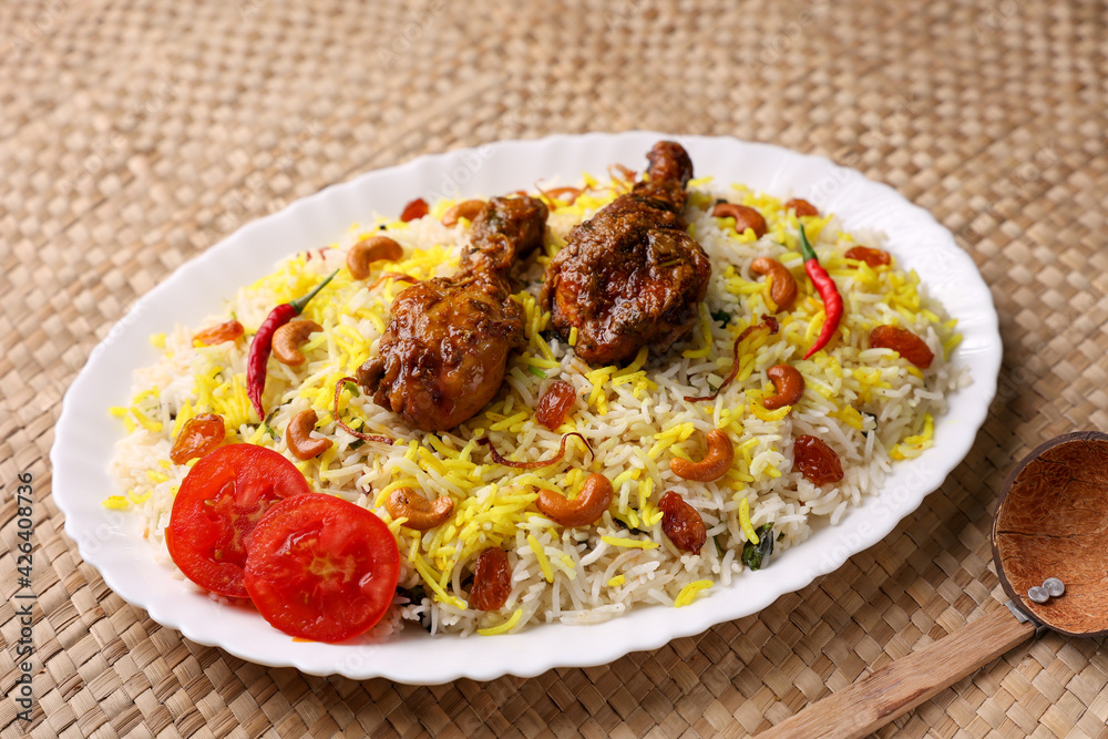 Chicken biryani Spicy Indian Malabar biryani Hyderabadi biryani, Dum Biriyani pulao golden bowl Kerala India Sri Lanka Pakistan basmati rice mixed rice dish with meat curry Ramadan Kareem, Eid Chicken biryani Spicy Indian Malabar biryani Hyderabadi biryani, Dum Biriyani pulao golden bowl Kerala India Sri Lanka Pakistan basmati rice mixed rice dish with meat curry Ramadan Kareem, Eid