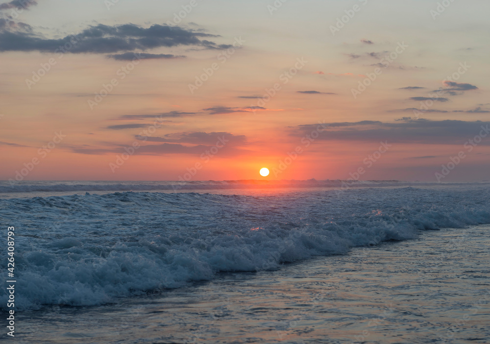 Fototapeta premium Beautiful sunset sky on the beach in Matapalo, Costa Rica. Central America. Sky background on sunset. Tropical sea.