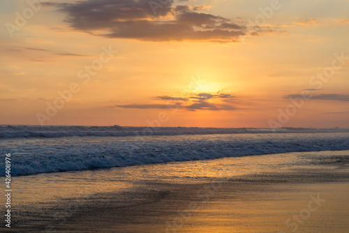Beautiful sunset sky on the beach in Matapalo, Costa Rica. Central America. Sky background on sunset. Tropical sea. © Valerija Dmitrijeva