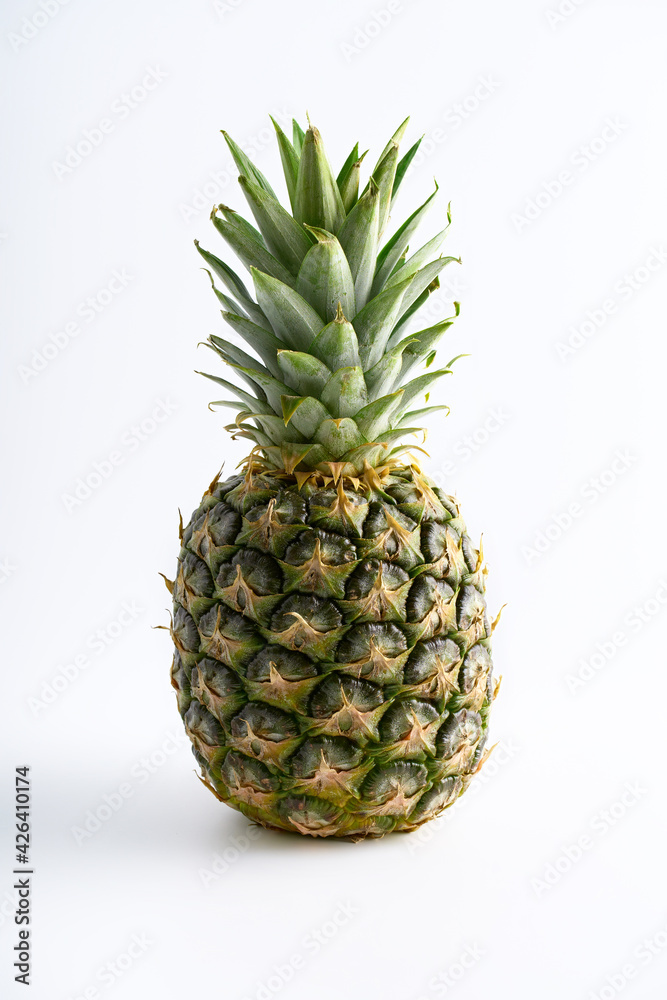ripe pineapple isolated on white background. Bright pineapple in minimal style. Fresh pineapples on blue background. Tropical fruits. Vegetarianism. Summer fruits. ripe pineapple isolated on white background. Bright pineapple in minimal style. Fresh pineapples on blue background. Tropical fruits. Vegetarianism. Summer fruits.