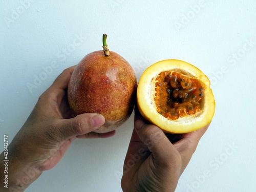 Passion fruit and an open fruit in which the pulp is clearly visible. (Passiflora edulis) Passiflora family. Manaus Amazonas, Brazil photo