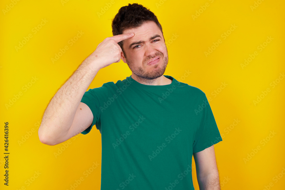 MODEL pointing unhappy at pimple on forehead, blackhead infection. Skincare concept. MODEL pointing unhappy at pimple on forehead, blackhead infection. Skincare concept.