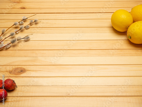 Lemons on a wooden table. View from above. Place for your text. Wooden background.