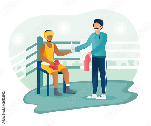 Male boxer recieves training manager guidance while resting in ring corner between rounds