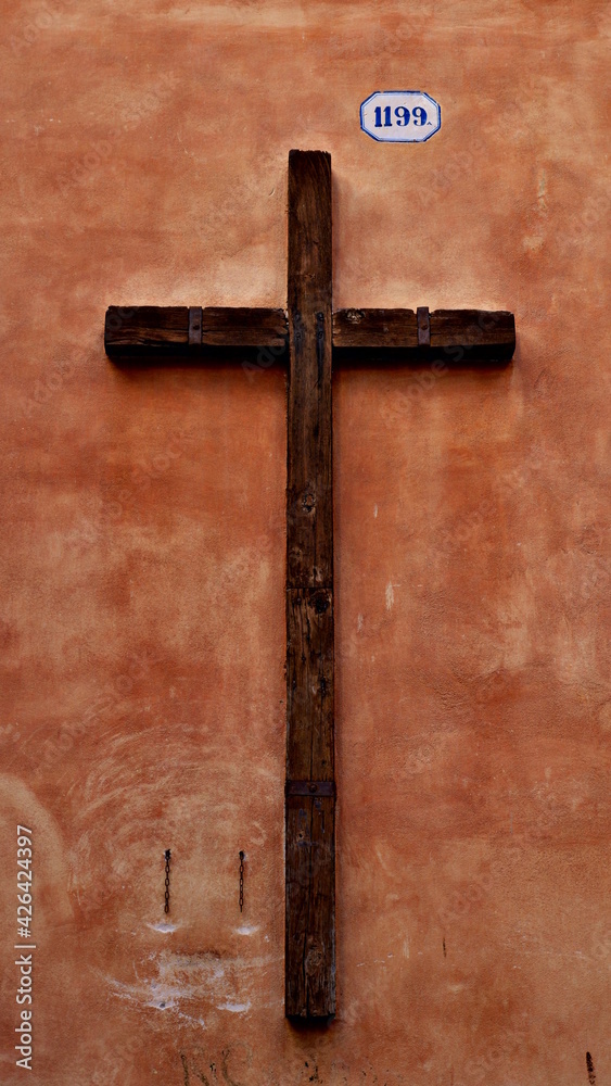 Cross on the wall, Italy