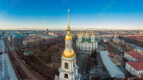 Aerial top view to St. Nicholas Naval Sea Cathedral in sunny day. Panorama of evening historical city center. Orthodox church located on banks of Kryukov and Griboyedov canal. Saint Petersburg. Russia