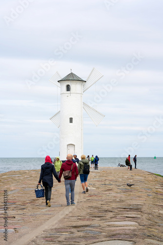 Holidaymakers at the Mühlenbake, the landmark of Swinoujscie on the Polish Baltic coast photo