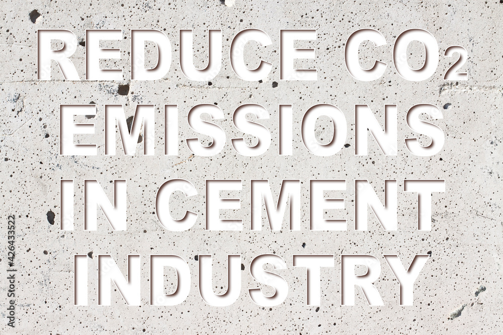 Reduce CO2 production in cement Industry and emissions in atmosphere - low-carbon cement production concept with a portland concrete wall and cement background Reduce CO2 production in cement Industry and emissions in atmosphere - low-carbon cement production concept with a portland concrete wall and cement background